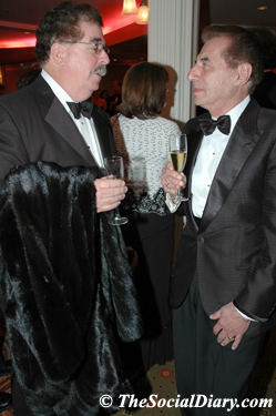 dr. richard greenfiield and leo zuckerman chatting over champagne
